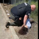 Image for article titled Video Appears to Show Police Officer Repeatedly Punching and Slamming a 14-Year-Old Black Child
